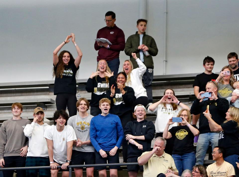 Penn fans celebrate after the boys swimming team finished second at the IHSAA state championship meet Saturday, Feb. 24, 2024, at the IU Natatorium in Indianapolis.