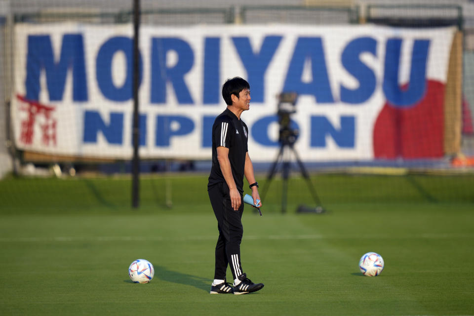 Japan's head coach Hajime Moriyasu walks on the pitch prior to Japan official training on the eve of the World Cup round of 16 soccer match between Japan and Croatia at the in Doha, Qatar, Sunday, Dec. 4, 2022. (AP Photo/Eugene Hoshiko)