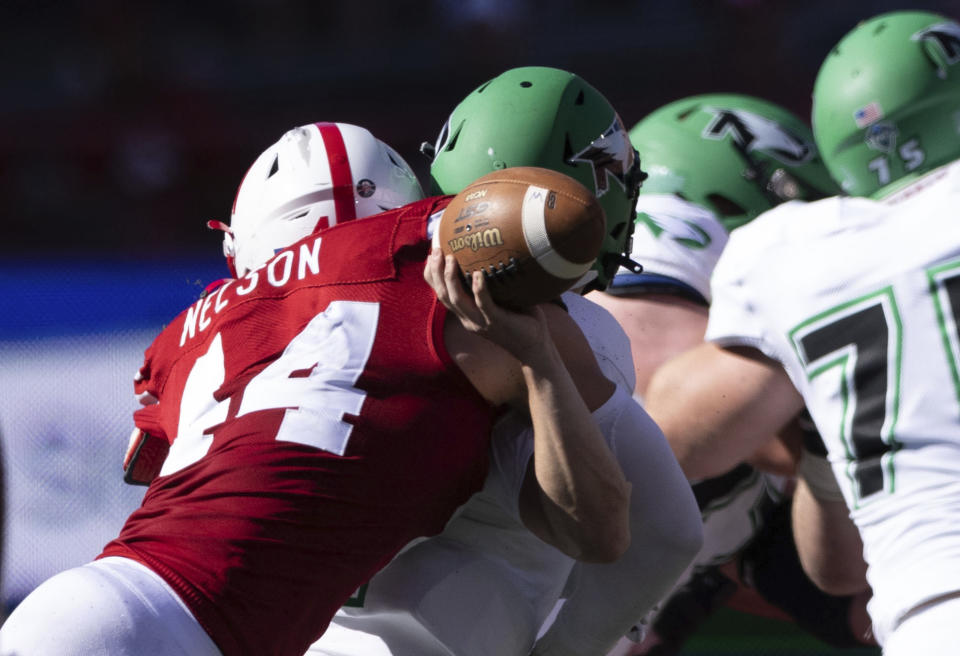 Nebraska's Garrett Nelson (44) sacks North Dakota quarterback Tommy Schuster during the second half of an NCAA college football game Saturday, Sept. 3, 2022, in Lincoln, Neb. Schuster fumbled the ball on the play and Nebraska defensive lineman Stephon Wynn Jr. recovered it. (AP Photo/Rebecca S. Gratz)