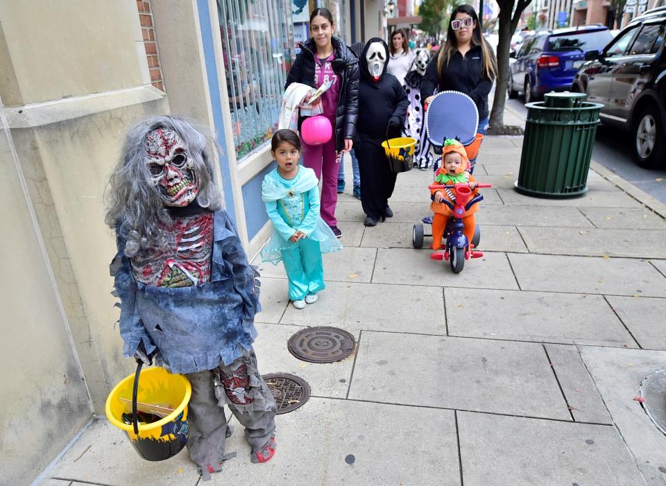 A scary monster pauses for a photo (and check out the face of the baby pumpkin in the background!). Hundreds of kids and families took over downtown Chambersburg on Saturday, Oct. 26, 2019, for the annual Trick or Treat on Main, hosted by Downtown Business Council.