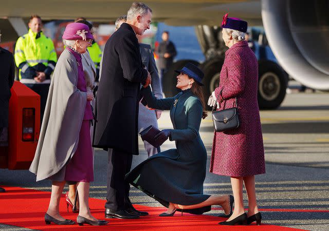 <p>LISELOTTE SABROE/Ritzau Scanpix/AFP via Getty </p> Crown Princess Mary of Denmark curtsies to King Felipe of Spain in November 2023