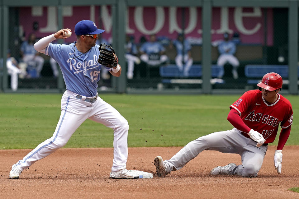 Los Angeles Angels' Shohei Ohtani is forced out at second by Kansas City Royals second baseman Whit Merrifield on a force out hit into by Taylor Ward during the fourth inning of a baseball game Wednesday, July 27, 2022, in Kansas City, Mo. (AP Photo/Charlie Riedel)