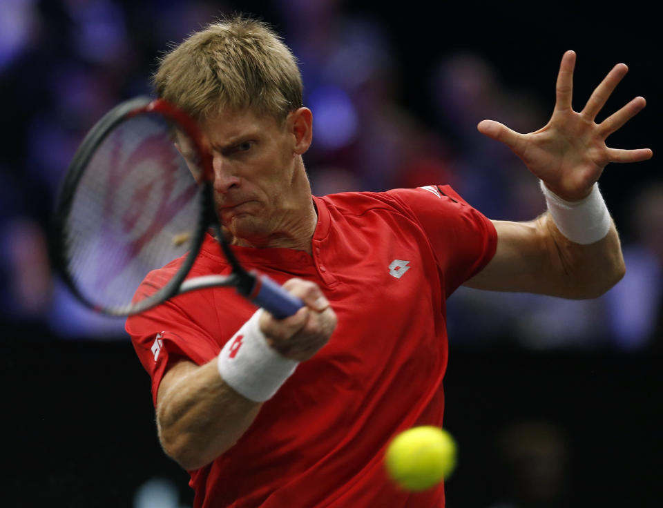 Team World's Kevin Anderson hits a return to Team Europe's Alexander Zverev during a men's singles tennis match at the Laver Cup, Sunday, Sept. 23, 2018, in Chicago. (AP Photo/Jim Young)