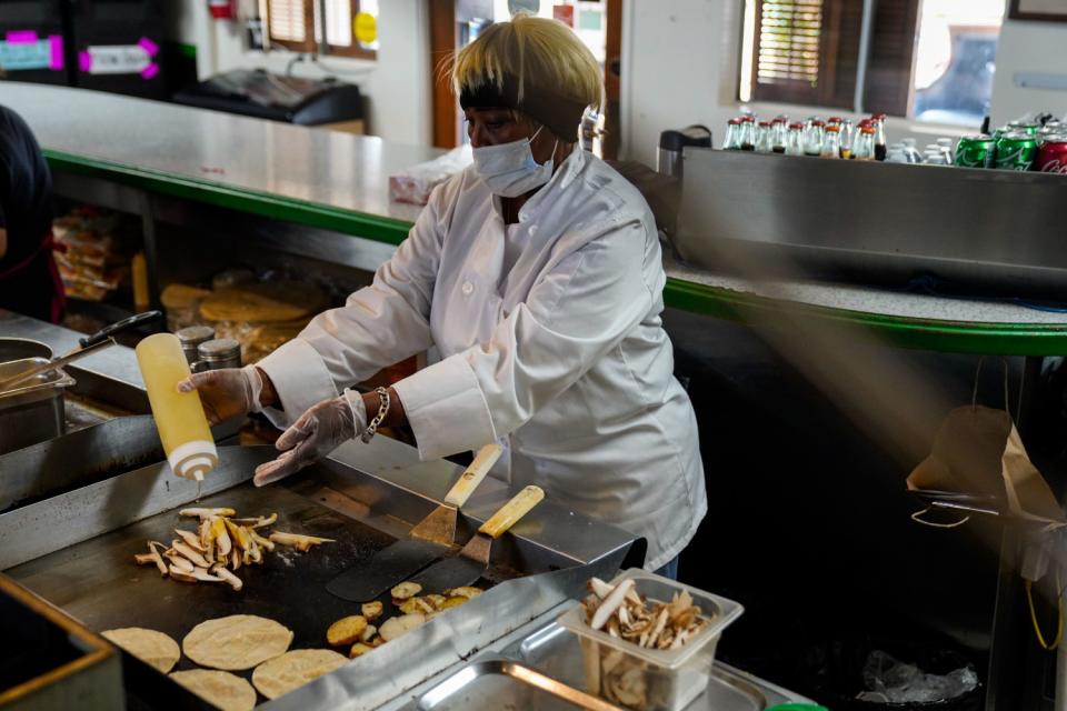 Barbara Burrell in the kitchen, prepares tacos at her restaurant Sky's Gourmet Tacos.