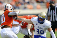 Tulsa linebacker Justin Wright (30) reaches for the ball controlled by Oklahoma State running back Chuba Hubbard (30) in the first half of an NCAA college football game, Saturday, Sept. 19, 2020, in Stillwater, Okla. (AP Photo/Brody Schmidt)