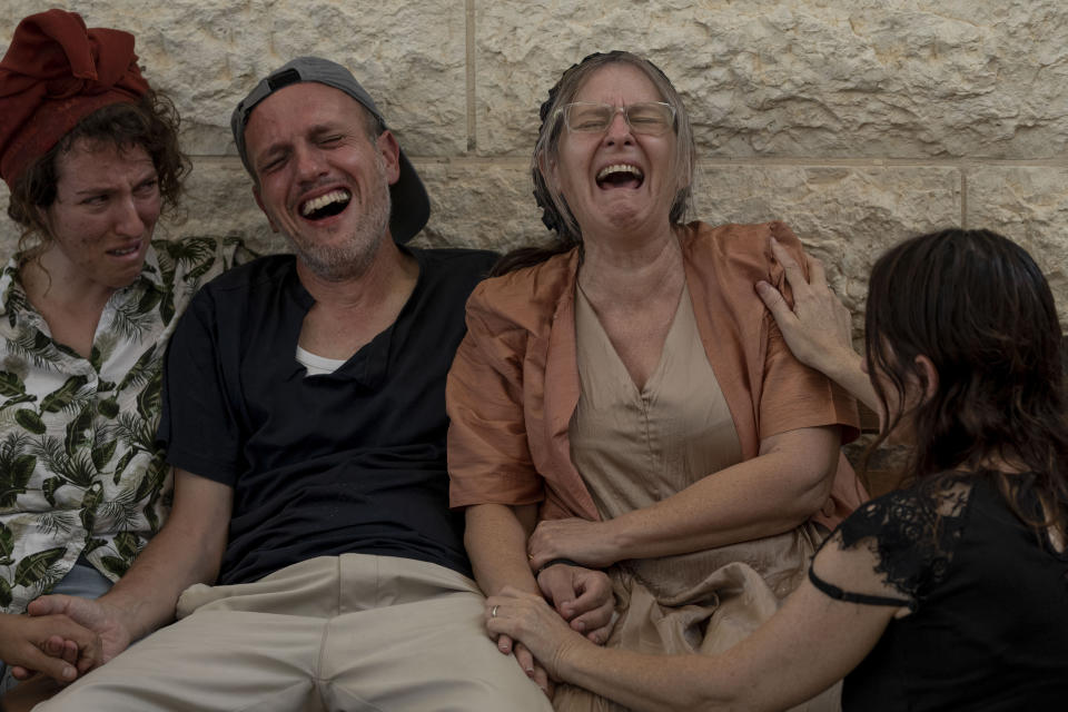 Itzik and Miriam Shafir, center, at the funeral of their son, Dor Shafir.