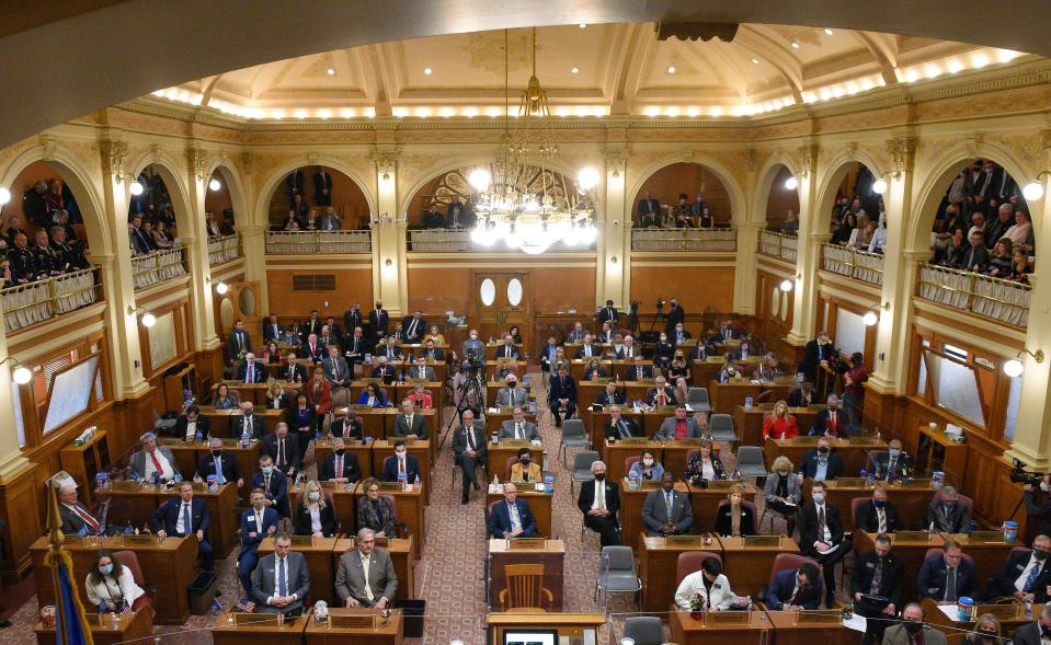 Lawmakers gather Tuesday, January 12, 2021, in the House of Representatives at the South Dakota State Capitol in Pierre.