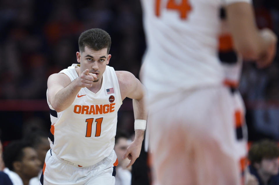 Syracuse guard Joseph Girard III (11) reacts after scoring against Notre Dame during the first half of an NCAA college basketball game in Syracuse, N.Y., Saturday, Jan. 14, 2023. (AP Photo/Adrian Kraus)