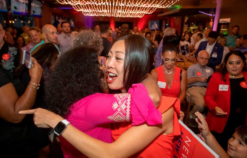 Lily Wu is hugged by supporters during the primary election for Wichita mayor in August. She faces current Mayor Brandon Whipple in the general election on November 7.