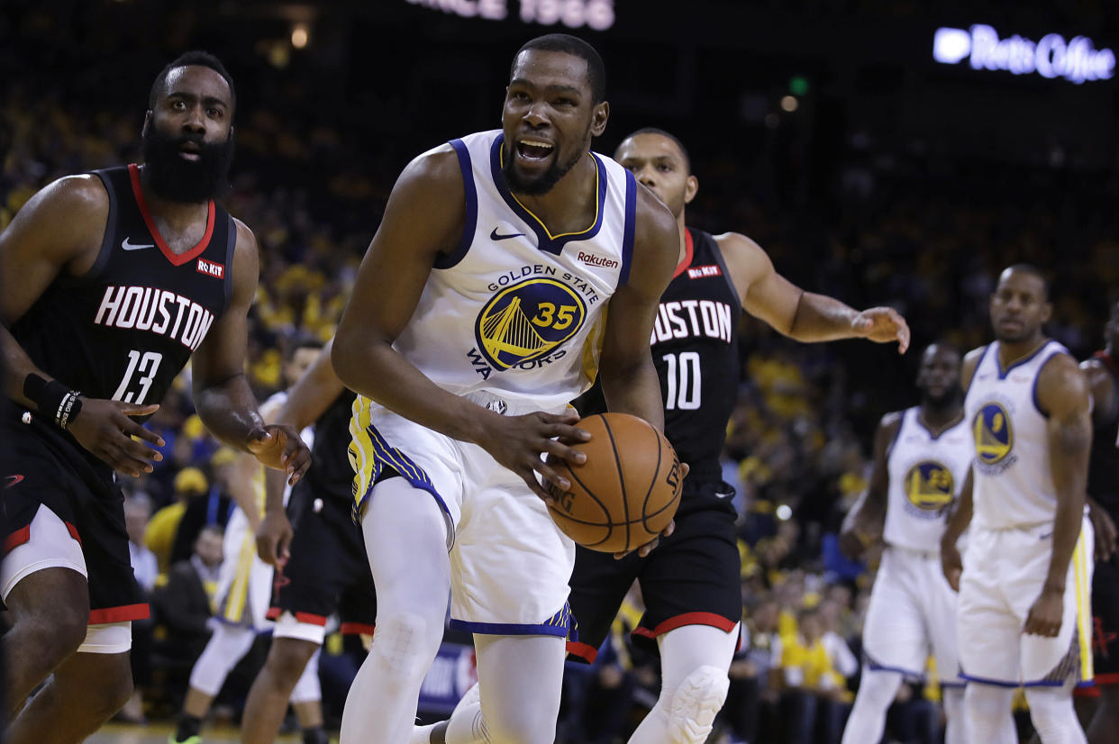 Houston Rockets' James Harden, left, and Golden State Warriors' Kevin Durant (35) react to a referee's call during the second half of Game 5 of a second-round NBA basketball playoff series Wednesday, May 8, 2019, in Oakland, Calif. (AP Photo/Ben Margot)