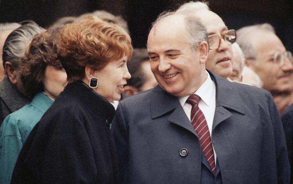 FILE - Soviet leader Mikhail Gorbachev and his wife Raisa in East Germany during youth rally in East Berlin, Germany, April 18, 1986. When Mikhail Gorbachev is buried Saturday at Moscow's Novodevichy Cemetery, he will once again be next to his wife, Raisa, with whom he shared the world stage in a visibly close and loving marriage that was unprecedented for a Soviet leader. Gorbachev's very public devotion to his family broke the stuffy mold of previous Soviet leaders, just as his openness to political reform did. (AP Photo/Fritz Reiss, File)