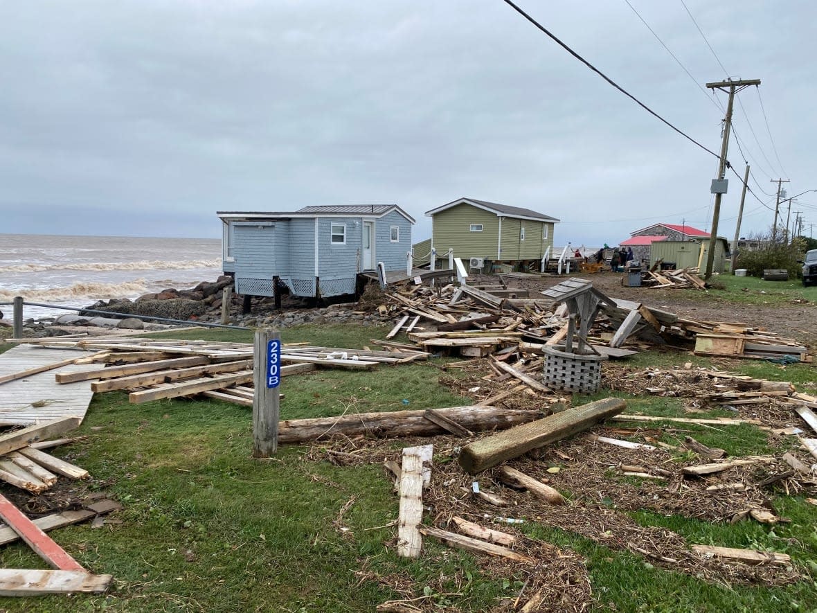 Structures along the coast in Caissie Cape, N.B. sustained damage from post-tropical storm Fiona on Saturday. Individuals, businesses, non-profit groups and municipalities can now apply for financial assistance for property damage caused by the storm. (Aniekan Etuhube/CBC - image credit)
