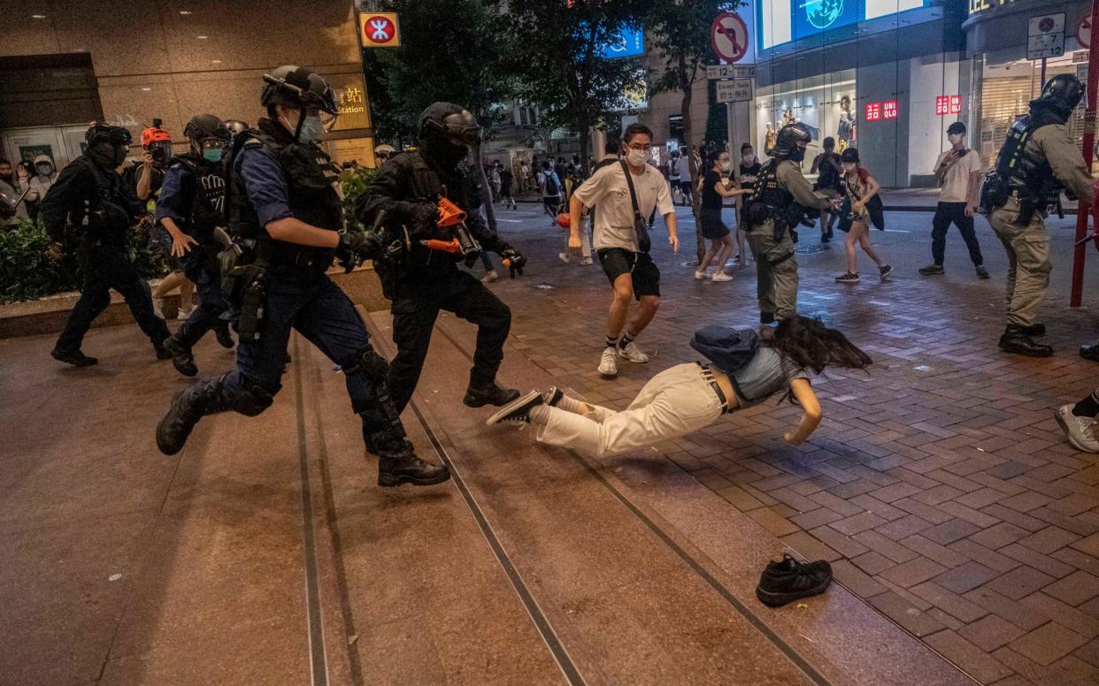 Police clash with protesters in Hong Kong on July 1 after the first arrests under China's new national security law as the city felt the chilling effect of Beijing's offensive to quash dissent in the territory  - LAM YIK FEI/NYTNS / Redux / eyevine