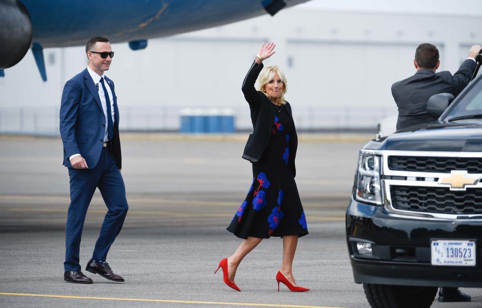 The First Lady, Dr. Jill Biden waves to the press while leaving with the secret service vehicle at the Nashville International Airport, in Nashville, Tenn., Wednesday, Oct. 12, 2022. Dr. Biden visits the city to promote COVID vaccination boosters. 