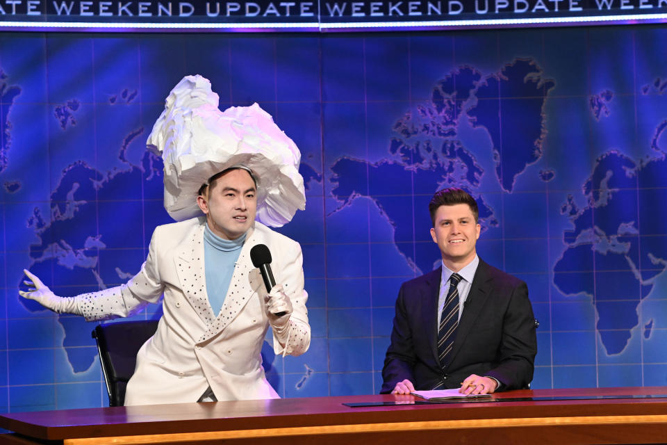 SATURDAY NIGHT LIVE -- "Carey Mulligan" Episode 1802 -- Pictured: (l-r) Bowen Yang as 'The Iceberg That Sank The Titanic' and anchor Colin Jost during Weekend Update on Saturday, April 10, 2021 -- (Photo By: Will Heath/NBC/NBCU Photo Bank via Getty Images)