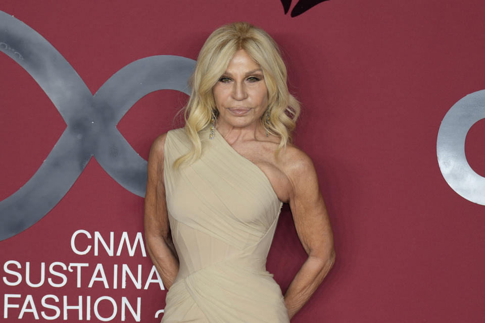 Donatella Versace poses for photographers as she arrives for the CNMI sustainable fashion 2023 awards in Milan, Italy, Sunday, Sept. 24, 2023. Donatella Versace slammed the Italian government for anti-gay policies in a heart-felt speech that referenced her late brother, Gianni Versace, while receiving a fashion award this weekend. (AP Photo/Antonio Calanni)