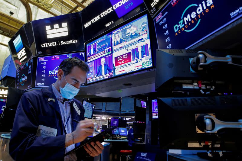 Traders work on the floor of the NYSE in New York