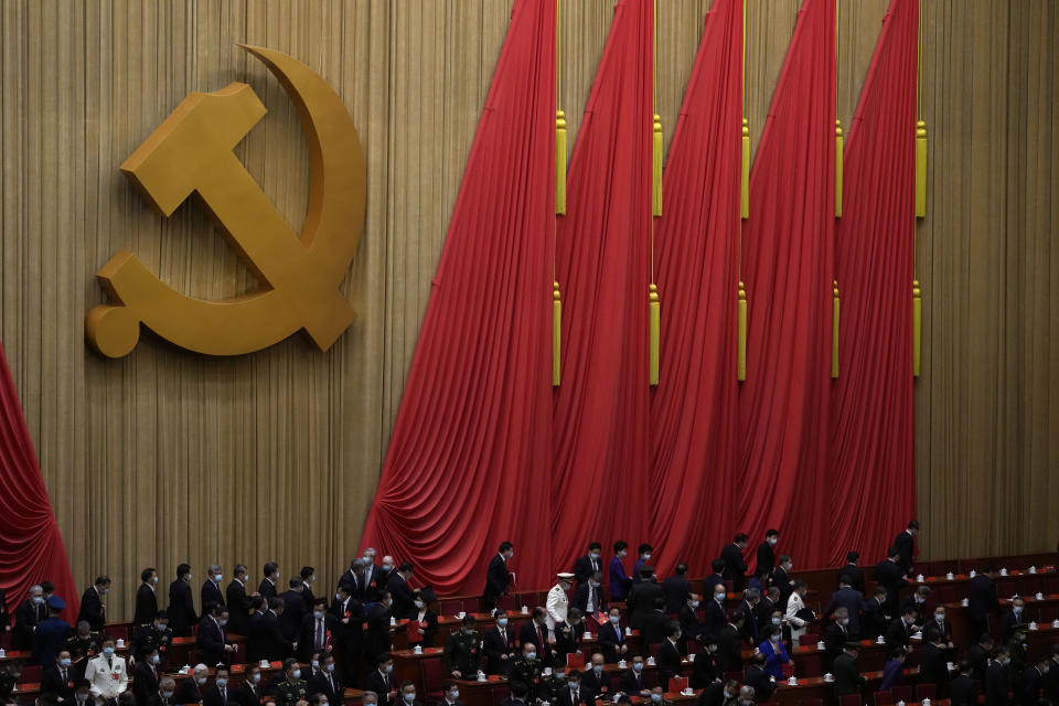 Delegates leave after the closing ceremony of the 20th National Congress of China's ruling Communist Party at the Great Hall of the People in Beijing, Saturday, Oct. 22, 2022. (AP Photo/Andy Wong)