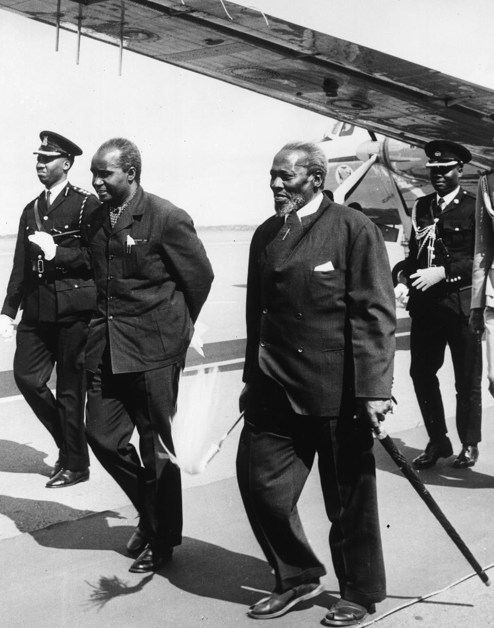 FILE - In this Feb. 21, 1969 file photo, Zambia President Kenneth Kaunda, left, is welcomed by Kenya President Jomo Kenyatta, right, at Nairobi Airport. Zambia’s first president Kenneth Kaunda has died at the age of 97, the country's president Edward Lungu announced Thursday June 17, 2021. (AP Photo/File)