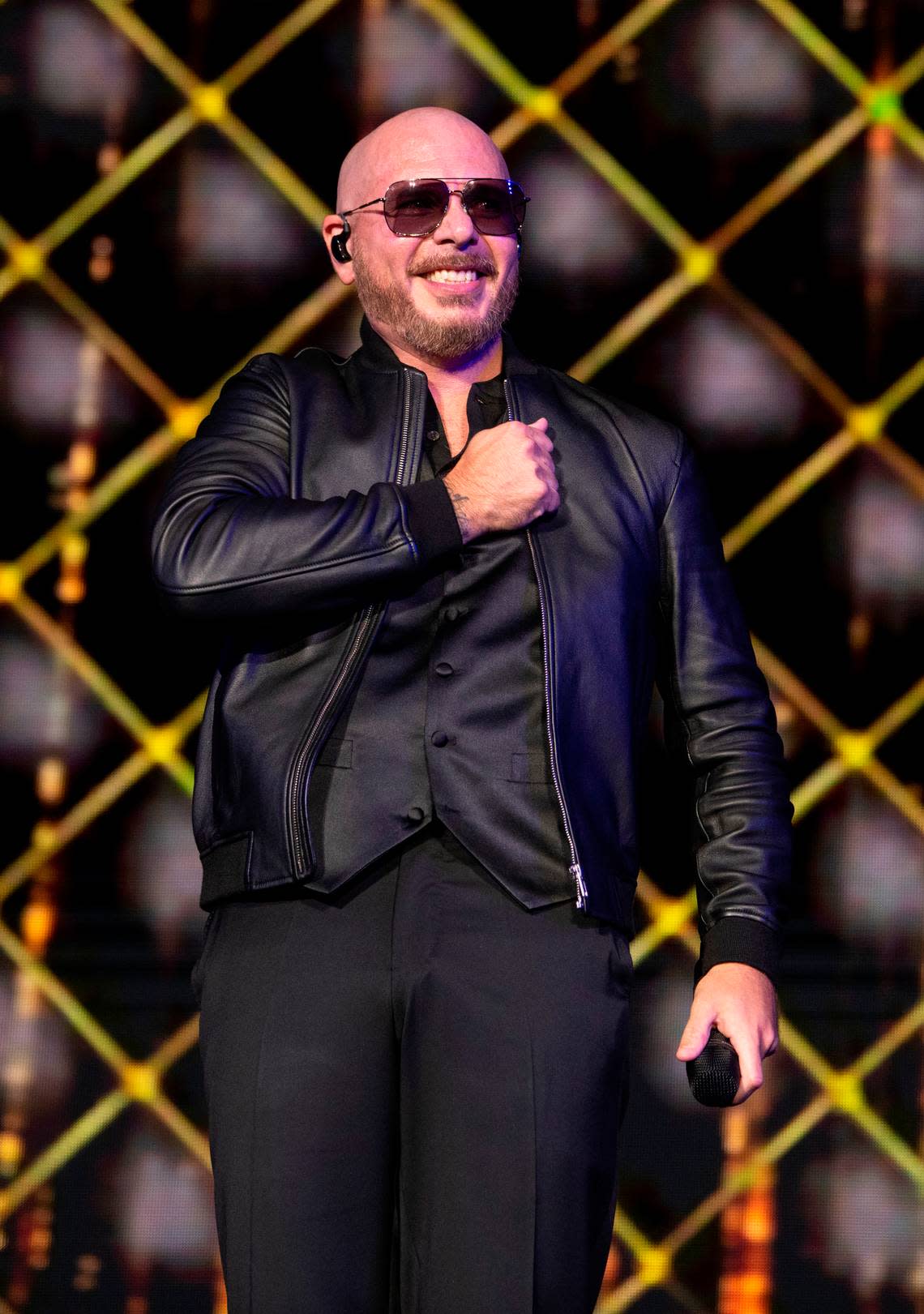 Pitbull reacts to the screaming crowd at Coastal Credit Union Music Pavilion at Walnut Creek in Raleigh, N.C., Thursday night, July 28, 2022.