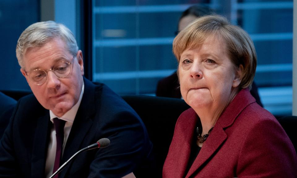 German Chancellor Angela Merkel (R) and CDU politician and head of the committee Norbert Roettgen take part in a session of the Committee of Foreign Affairs of the Bundestag (lower house of parliament) on January 16, 2019 in Berlin. - Merkel said "we still have time to negotiate" after the British parliament overwhelmingly rejected Prime Minister's deal on leaving the European Union. (Photo by Kay Nietfeld / dpa / AFP) / Germany OUT        (Photo credit should read KAY NIETFELD/DPA/AFP via Getty Images)