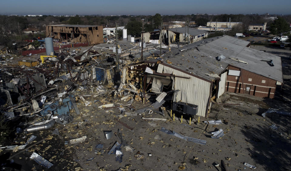 This Jan. 24, 2020, file aerial photo shows the scene of an explosion that rocked northwest Houston. A company filed for bankruptcy Thursday, Feb. 6, 2020, in the wake of a massive explosion at one of its warehouses in Houston that killed two workers, injured 20 more and damaged hundreds of buildings. Watson Grinding and Manufacturing said it filed for Chapter 11 bankruptcy in Houston federal court because of what it expects to be “a long-term interruption of business operations” due to the Jan. 24 blast. (Godofredo A. Vásquez/Houston Chronicle via AP)