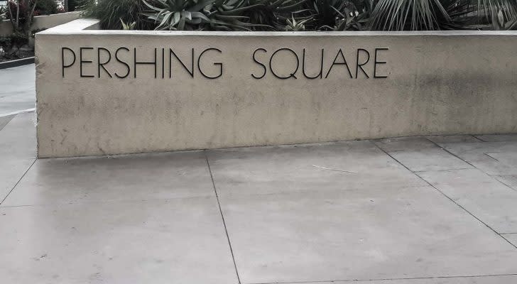 A Pershing Square sign on a cement wall.