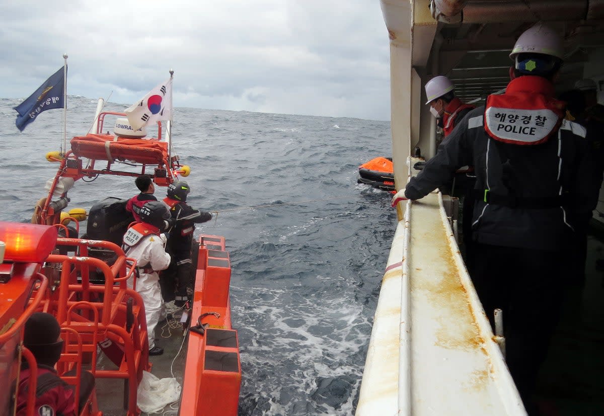 Coast guard forces searching for missing people after a Hong Kong cargo ship sank off South Korea's southern island of Jeju (KOREA COAST GUARD/AFP via Getty)