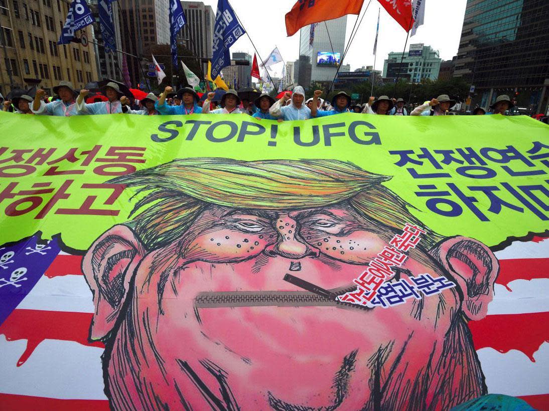 Protesters in South Korea at a peace rally, amid rising tensions on the peninsula: JUNG Yeon-JeJUNG YEON-JE/AFP/Getty Images