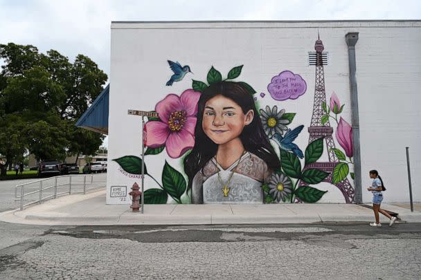 PHOTO: Caitlyne Gonzales walks by a mural of her best friend, Jackie Cazares, Sept. 4, 2022, in Uvalde, Texas. (The Washington Post via Getty Images)