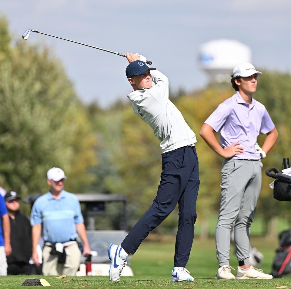 Jaden Solheim of Watertown (right) looks on as O'Gorman's Jayden Antonen hits a tee shot during the final round of the state Class AA high school boys golf tournament on Tuesday, Oct. 3, 2023 at the Brandon Golf Course.