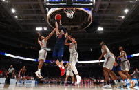 <p>Scottie James #31 of the Liberty Flames drives to the basket against Wabissa Bede #3 and Kerry Blackshear Jr. #24 of the Virginia Tech Hokies in the first half during the second round of the 2019 NCAA Men’s Basketball Tournament at SAP Center on March 24, 2019 in San Jose, California. (Photo by Yong Teck Lim/Getty Images) </p>