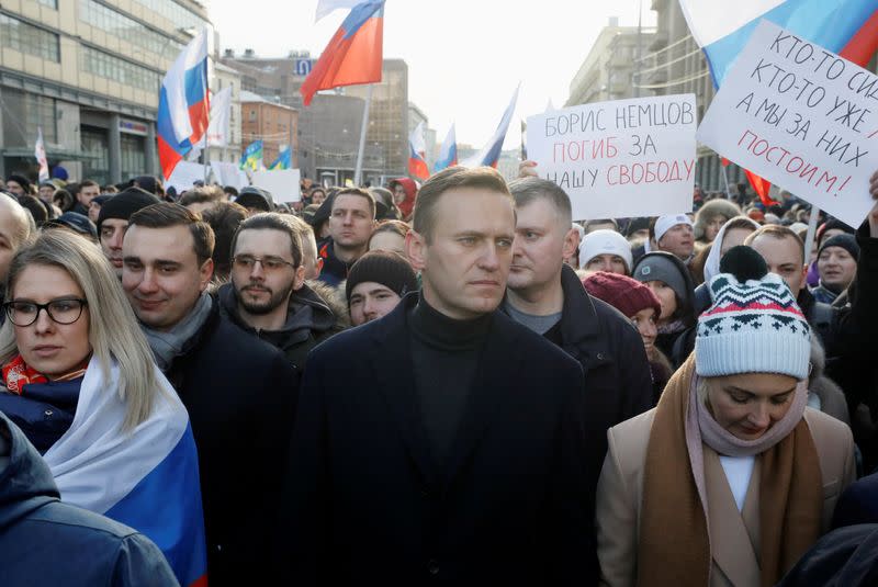 FILE PHOTO: People take part in a rally to mark the 5th anniversary of opposition politician Boris Nemtsov's murder and to protest against proposed amendments to the country's constitution, in Moscow