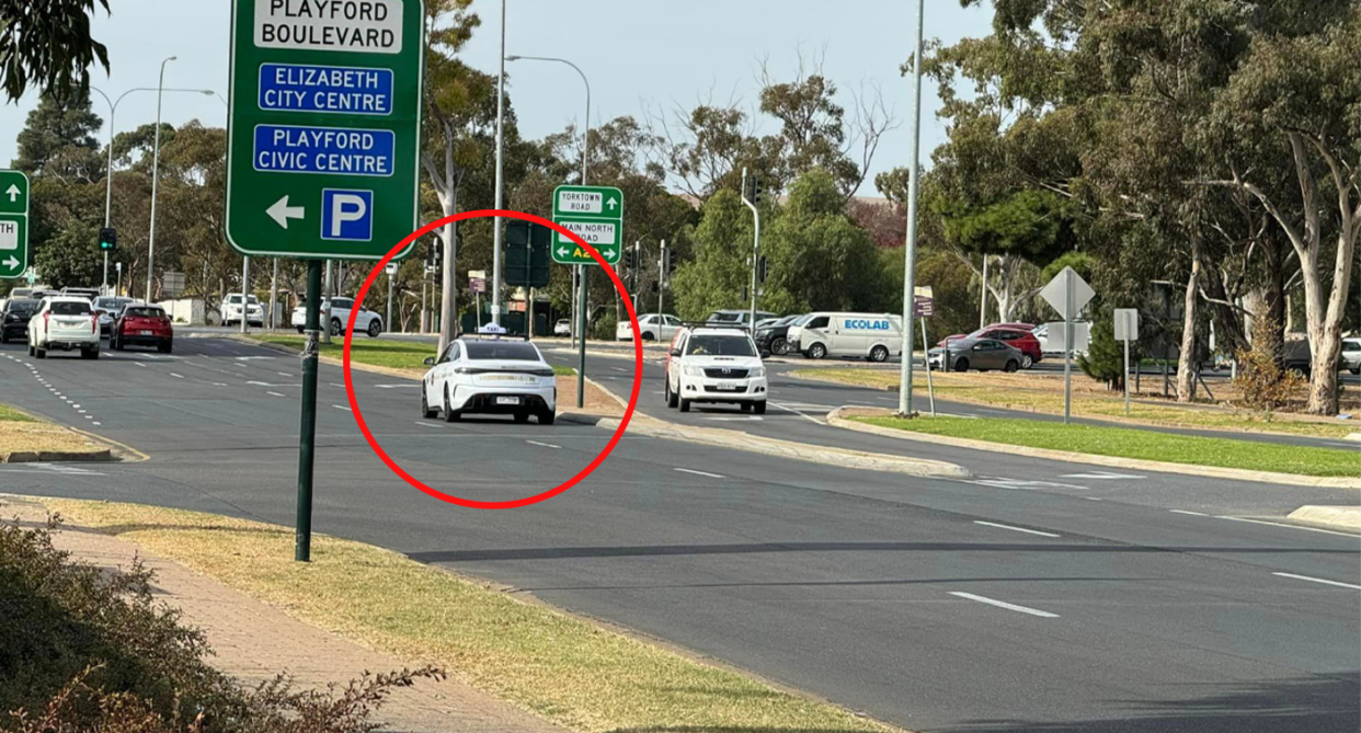 A BYD electric taxi seen driving on the road in Adelaide, South Australia. 