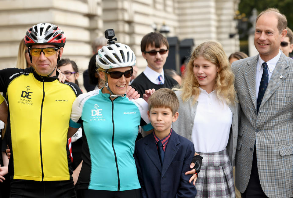 LONDON, ENGLAND - SEPTEMBER 25:  Sophie, Countess of Wessex poses with her family James, Viscount Severn, Lady Louise Windsor and Edward, Earl of Wessex in the forecourt of Buckingham Palace after finishing her bike ride from Edinburgh to London in support of The Duke of Edinburgh's Award on September 25, 2016 in London, England. The Countess and the other riders were presented with a Diamond Pin to mark the completion of the Diamond Challenge. The Countess of Wessex cycled 445 miles from the Palace of Holyroodhouse, Edinburgh to Buckingham Palace, London over seven days as her 'Diamond Challenge' - a special initiative marking the 60th anniversary of the Duke of Edinburgh's Award. (Photo by Anwar Hussein/WireImage)
