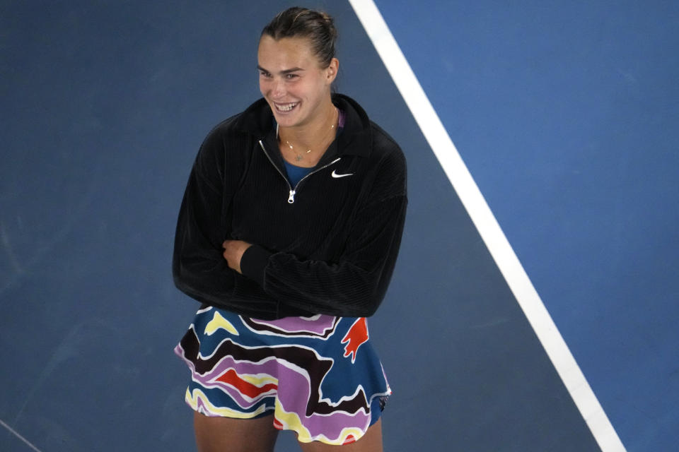Aryna Sabalenka of Belarus smiles during a post match interview after defeating Magda Linette of Poland in their semifinal match at the Australian Open tennis championship in Melbourne, Australia, Thursday, Jan. 26, 2023. (AP Photo/Ng Han Guan)