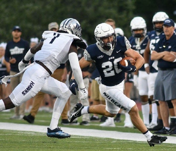 Dylan Laube, right, is expected to return to the University of New Hampshire football team for Saturday's game against Elon. Laube, who leads the Wildcats in rushing with 577 yards and six rushing touchdowns, did not play last week against Dartmouth.