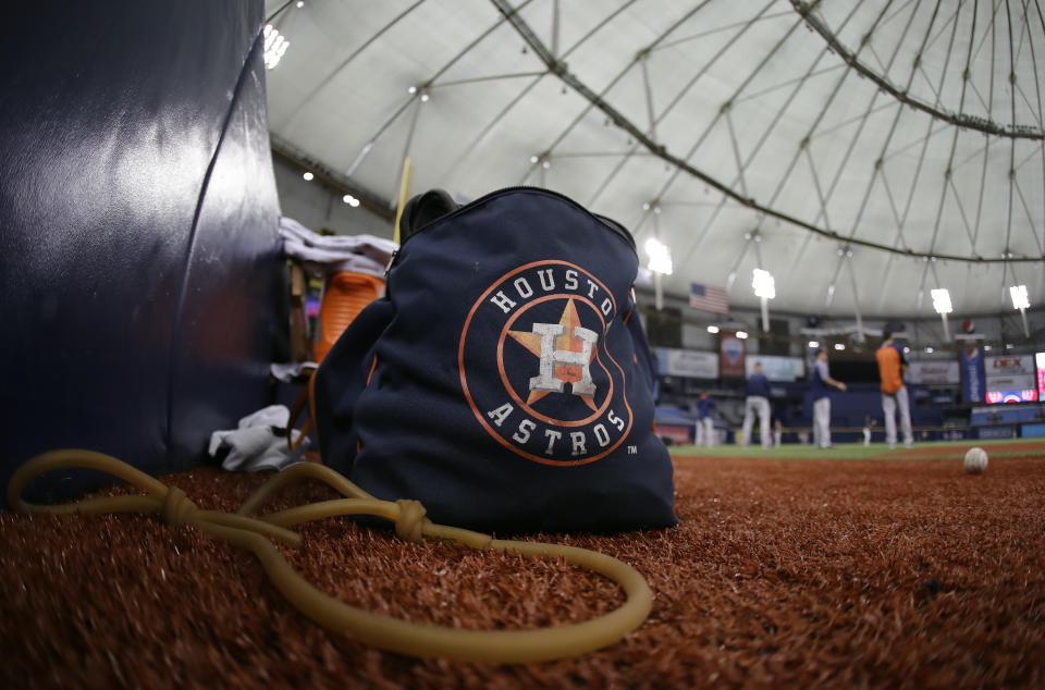 Astros players warm up before Tuesday’s game against the Rangers in St. Petersburg, Fla. The three-game series was moved to St. Petersburg because of unsafe conditions from Hurricane Harvey. (AP)