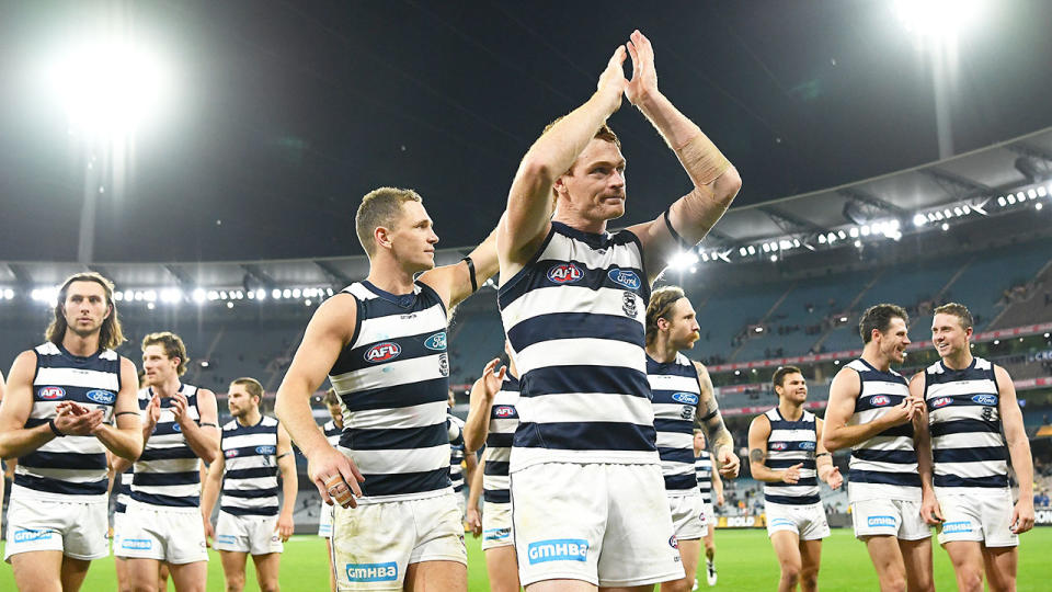 Pictured here, Geelong players thank their fans after the win against Richmond.