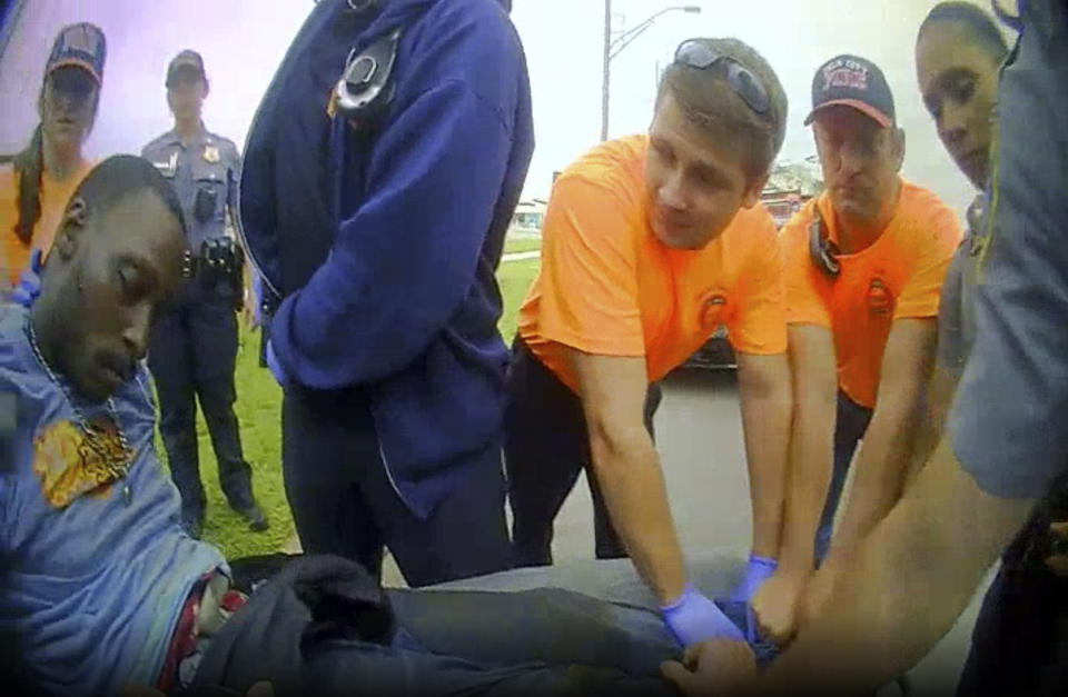 FILE - In this image made from a May 2019 body-camera video of Oklahoma City Police Officer Ashley Copeland, paramedics and police officers carry Derrick Elliot Scott onto a stretcher after he was arrested and went in and out of consciousness during the arrest in Oklahoma City. Oklahoma City police released the videos June 2020, of Scott, an armed black man who died in police custody in 2019 after telling arresting officers "I can't breathe." Around the U.S., protesters have been calling for prosecutors to take a second look at police killings of Black people, including Scott. (Oklahoma City Police Department via AP, File)