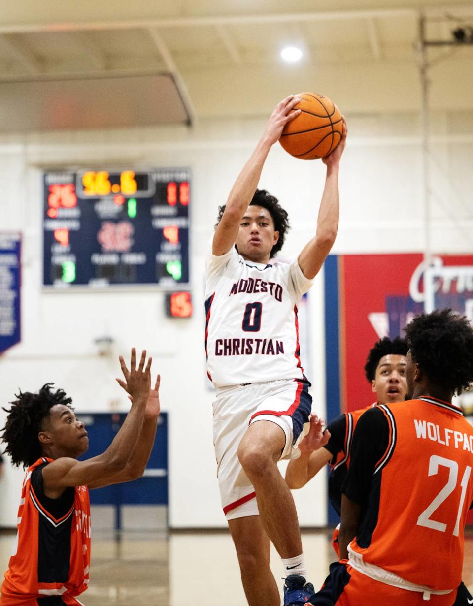 Modesto Christian’s Myles Jones drives to the basket during the Sac-Joaquin Section Division I playoff game with Cosumnes Oaks at Modesto Christian High School in Salida, Calif., Wednesday, Feb. 14, 2024.