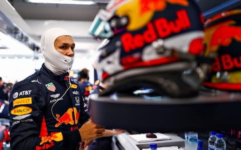 Alexander Albon of Thailand and Red Bull Racing prepares to drive in the garage during practice for the F1 Grand Prix of Singapore at Marina Bay Street Circuit on September 20, 2019 in Singapore - Credit: Getty Images