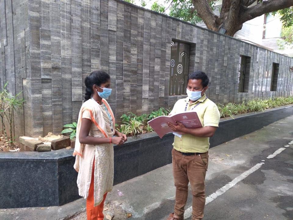 Two health volunteers take stalk of the day’s programme in Chennai.