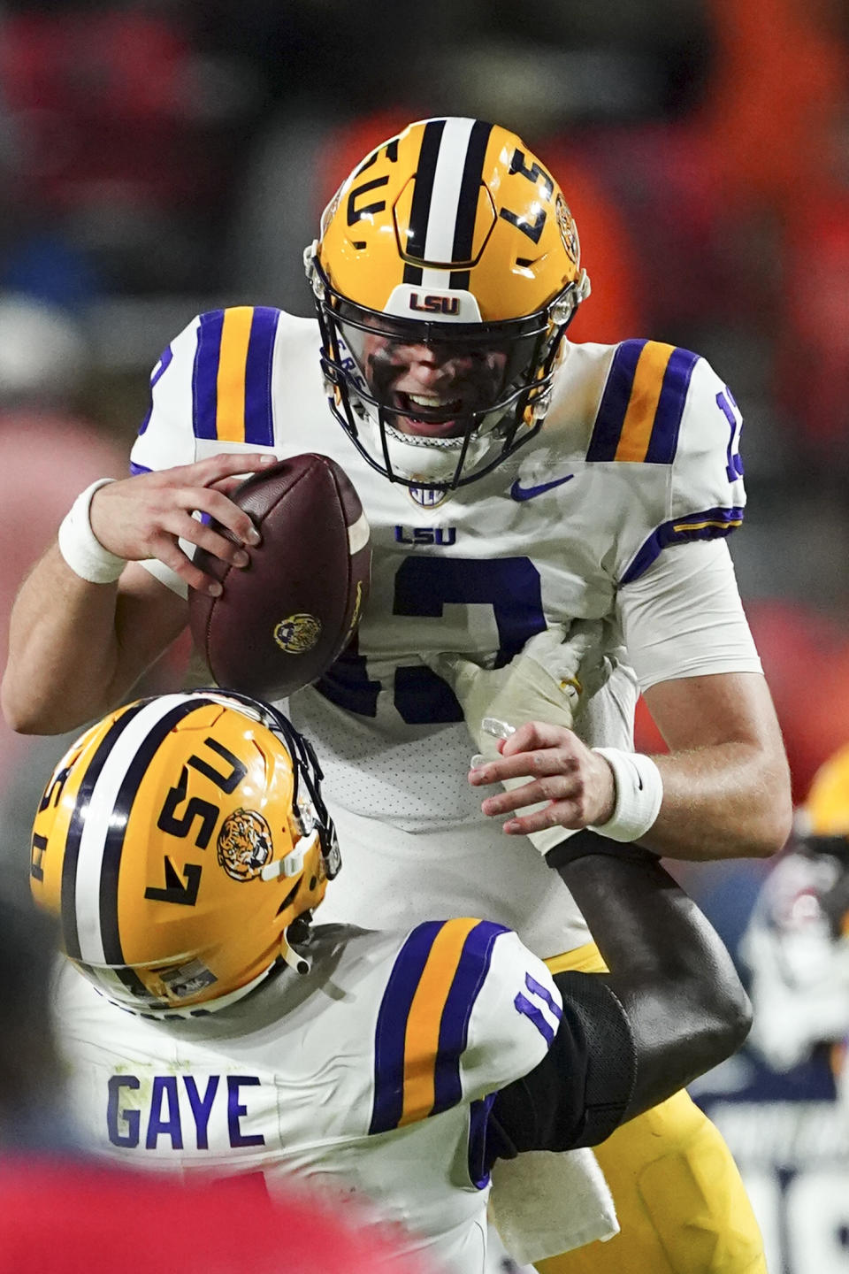 LSU quarterback Garrett Nussmeier (13) celebrates with defensive end Ali Gaye (11) after defeating Auburn in the second half of an NCAA college football game Saturday, Oct. 1, 2022, in Auburn, Ala. (AP Photo/John Bazemore)