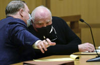 Michael Skakel, right, appears for his hearing at Stamford Superior Court, with his attorney Stephan Seeger, Friday, Oct. 30, 2020, in Stamford, Conn. A Connecticut prosecutor says Kennedy cousin Michael Skakel will not face a second trial in the 1975 murder of teenager Martha Moxley in Greenwich. (Erik Trautmann/Hearst Connecticut Media via AP, Pool)