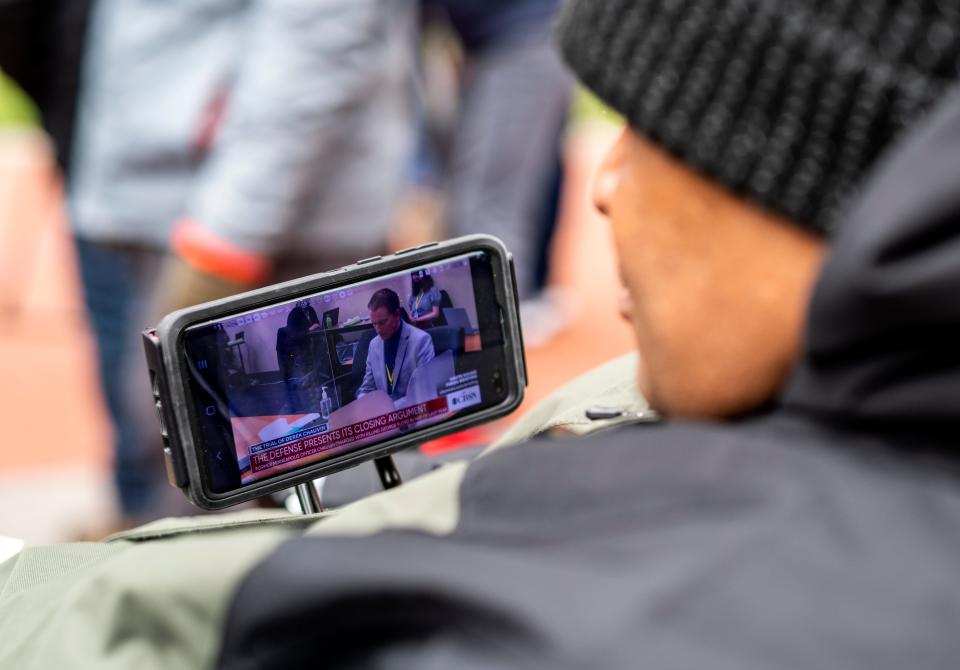 Michael Jones watches closing arguments in the Derek Chauvin trial outside the Hennepin County Government Center on April 19, 2021 in Minneapolis, Minn. 