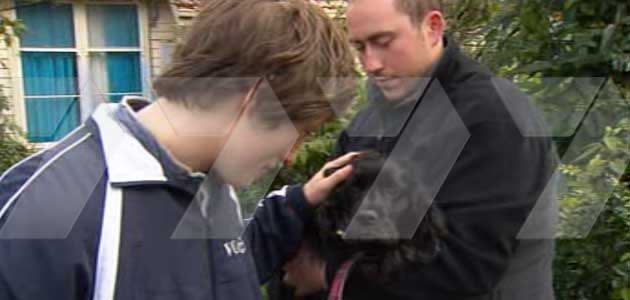 Andrew (left) and Alan (right) reunited with Bosley after he was injured in a vicious dog attack. Photo: 7News