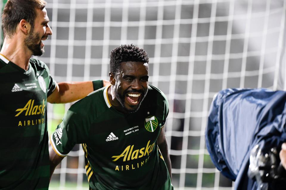 The Portland Timbers' Larrys Mabiala celebrates his goal in a 2-1 win over Orlando City in the MLS is Back Tournament final.