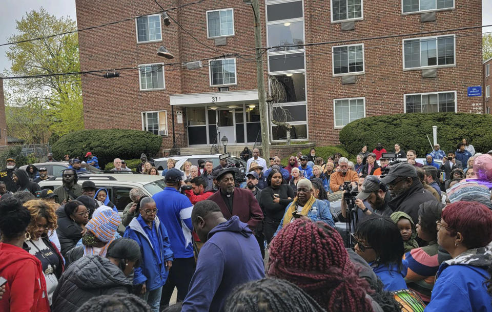 This image provided by Jeremy Stein shows a crowd gathering in Hartford, Conn., on Saturday, April 22, 2023, for a vigil on the same street where Se'Cret Pierce, 12, was shot in the head by a stray bullet during a drive-by shooting Thursday. She died the following morning. (Jeremy Stein via AP)
