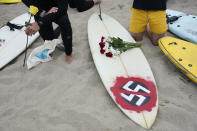 Surfers participate in a paddle out ceremony at "The Ink Well," a beach historically known as a surfing refuge for African Americans, to honor the life of George Floyd on Friday, June 5, 2020, in Santa Monica, Calif. Floyd died after he was restrained in police custody on Memorial Day in Minneapolis. (AP Photo/Ashley Landis)